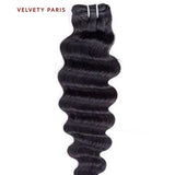 Tissage deep wave en cheveux virgins péruviens 100% naturels, avec boucles définies.