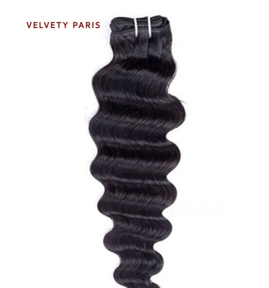 Tissage deep wave en cheveux virgins péruviens 100% naturels, avec boucles définies.