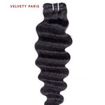 Tissage deep wave en cheveux virgins péruviens 100% naturels, avec boucles définies.